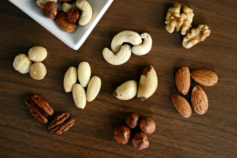 variety of brown nuts on brown wooden panel high angle photo